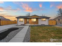 Charming home featuring a well-manicured front yard and a stylishly updated exterior at 9230 Aspen Dr, Thornton, CO 80229
