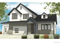 Charming two-story home with stone accents, an attached garage and a well-manicured front yard at 961 Eldorado Ln, Louisville, CO 80027
