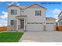 Under construction, this home boasts a three-car garage and stone accents at 13804 Quartz St, Mead, CO 80504