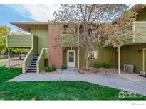 Exterior shot of the home featuring a walkway and stairs leading to the entrance at 1410 Bacchus Dr # B12, Lafayette, CO 80026