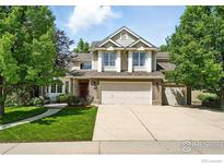 Charming two-story home with a well-manicured lawn and a spacious three-car garage at 1900 Eldorado Cir, Superior, CO 80027