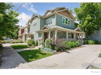 Charming two-story home with a welcoming front porch and well-maintained landscaping at 1944 Arapahoe Ave # A, Boulder, CO 80302