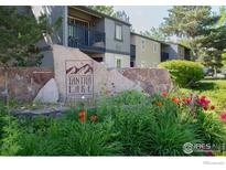 Attractive view of the Tantra Lake apartment community sign, complete with lovely flowerbeds and landscaping at 750 W Moorhead Cir # A, Boulder, CO 80305