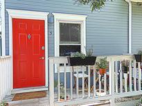 Inviting front porch with a bright red door, perfect for adding curb appeal with flowers and decor at 2205 Arapahoe Ave # 3, Boulder, CO 80302