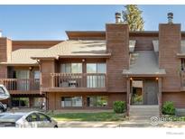 Inviting two-story exterior showcasing the building's architectural details and private balcony at 2636 Juniper Ave # 1, Boulder, CO 80304