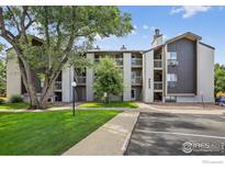 Multi-story apartment building with well-maintained landscaping and convenient parking spaces at 3535 28Th St # 202, Boulder, CO 80301
