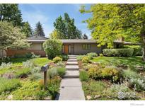 Charming single-story home featuring a well-manicured front yard and inviting curb appeal at 4160 Caddo Pkwy, Boulder, CO 80303