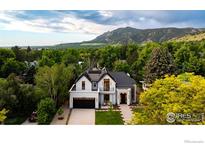 Stunning exterior view of a modern home with mountain views and professional landscaping at 640 Iris Ave, Boulder, CO 80304