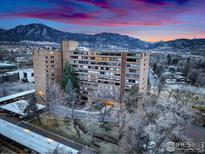Striking building with a mountain backdrop, providing breathtaking views and urban living at 1850 Folsom St # 706, Boulder, CO 80302