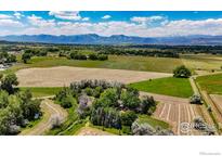 Expansive aerial view of the property featuring lush greenery and majestic mountain views at 2221 N 95Th St, Boulder, CO 80301