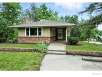 Charming single-story home featuring a well-maintained front yard and brick accents at 775 Pleasant St, Boulder, CO 80302