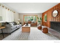 Inviting living room featuring stylish sofas, a modern coffee table, and large windows offering natural light at 775 Pleasant St, Boulder, CO 80302