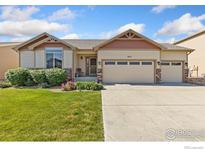 Charming ranch style home with a well maintained lawn and a three car garage, located in a quiet neighborhood at 1613 Alpine Ave, Berthoud, CO 80513