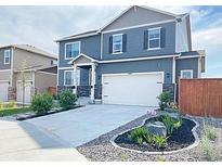 Charming two-story home with a well-manicured lawn and a two-car garage at 4403 Garnet Way, Longmont, CO 80504