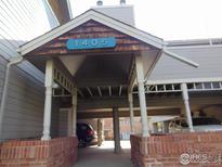 Covered carport area with brick supports and unit number at 1405 Broadway St # 302, Boulder, CO 80302