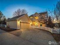 Charming two-story home with a two-car garage, fenced yard, and a welcoming entrance at 2946 Shoshone Trl, Lafayette, CO 80026