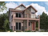 Charming two-story home featuring a stone facade, balcony, and inviting covered porch at 3852 W 83Rd Ln, Westminster, CO 80031