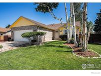 Charming, well-maintained home with lush lawn and mature trees at 1030 S Fulton Ave, Fort Lupton, CO 80621