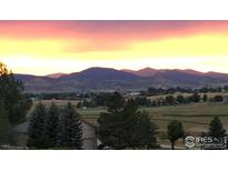 Scenic mountain view from the property at sunset, with beautiful colorful clouds at 612 Joyce Ct, Berthoud, CO 80513