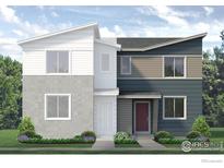 Modern two-story home featuring a unique, two-tone exterior and neatly landscaped front yard at 1458 Coral Pl, Longmont, CO 80504