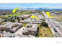 Community aerial view featuring neighborhood amenities, Broadlands Golf Course, Safeway, and Holy Gathering High School at 3577 Molly Cir, Broomfield, CO 80023