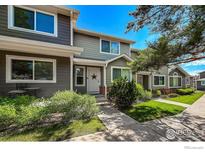 Charming townhome showcasing lush landscaping, a welcoming entrance, and a well-maintained facade at 51 21St Ave # 43, Longmont, CO 80501