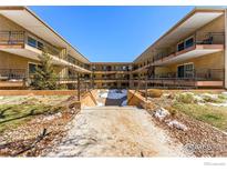 Inviting courtyard view featuring well-maintained landscaping and pathways leading to the building entrances at 830 20Th St # 203, Boulder, CO 80302