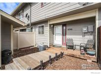 Charming front porch with outdoor seating area and well-maintained landscaping at 8746 at 8746 Carr Loop, Arvada, CO 80005