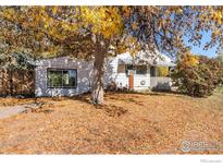 Charming single-story home with mature tree providing beautiful fall foliage and curb appeal at 1109 Ironton St, Aurora, CO 80010