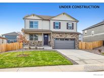Charming two-story home with a well-manicured lawn and a two-car garage, still under construction at 1907 Mount Monroe Dr, Berthoud, CO 80513
