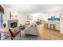 Inviting living room featuring a cozy fireplace and open floor plan at 2800 Kalmia Ave # A220, Boulder, CO 80301