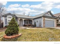 Charming single-story home featuring a covered front porch and well-maintained landscaping at 4644 W 112Th Ct, Westminster, CO 80031