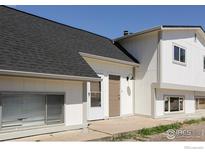 Inviting home exterior featuring a well-maintained lawn, and stylish front door at 3051 Craft Way, Westminster, CO 80030