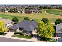 Stunning home featuring a well-maintained yard and golf course views in a desirable neighborhood at 8305 E 149Th Dr, Thornton, CO 80602
