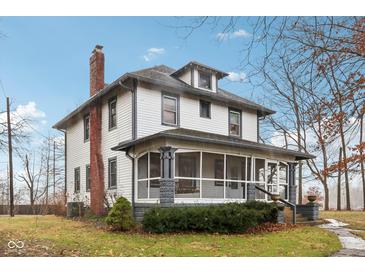 Two-story house with front porch and landscaped yard at 1185 N 10Th St, Noblesville, IN 46060