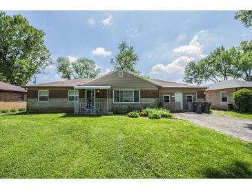 Charming single-story home featuring a well-maintained lawn and inviting curb appeal at 2925 Highwoods Dr, Indianapolis, IN 46222