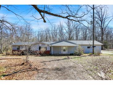 Charming ranch-style home featuring neutral siding, a covered entryway, and a well-maintained front yard on a sunny day at 7635 Grizzly Dr, Nineveh, IN 46164