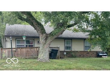Charming single-story home with neutral siding, brick foundation, and well-manicured lawn, offering cozy curb appeal at 1902 Edgemont Way, Anderson, IN 46011