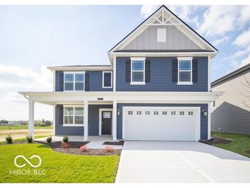Beautiful two-story home with a blue exterior, white trim, and a two-car garage at 1537 Hanover St, Danville, IN 46122