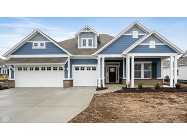 Two-story home with blue siding, white trim, and a three-car garage at 15786 Vitalize Run, Fishers, IN 46040