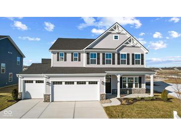 Two-story home with gray siding, white trim, and a two-car garage at 230 Mcnair Rd, Whiteland, IN 46184