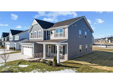 Two-story gray house with white accents, stone facade, and a covered porch at 250 Mcnair Rd, Whiteland, IN 46184