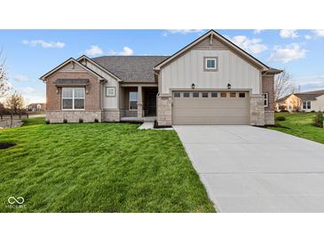 Brick and shingle ranch home with 2-car garage and landscaped lawn at 4996 Hummingbird Dr, Brownsburg, IN 46112