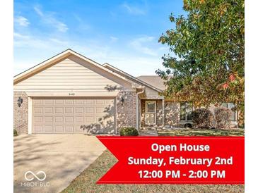 Brick ranch home with attached garage and landscaped yard at 5445 Carnoustie Cir # 12A, Avon, IN 46123