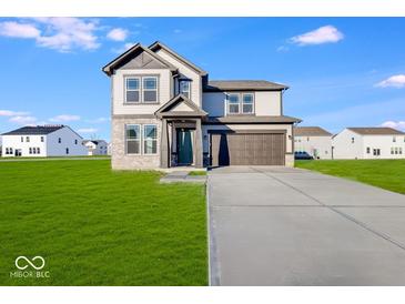 Two-story house with a brown door and attached garage at 1116 Bevy Blvd, Danville, IN 46122