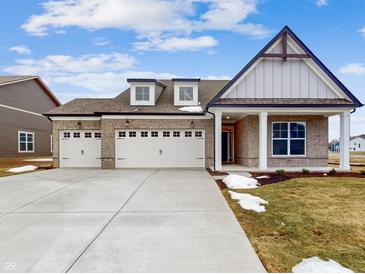 Two-story craftsman home with three-car garage and inviting front porch at 5005 Carmine St, Brownsburg, IN 46112