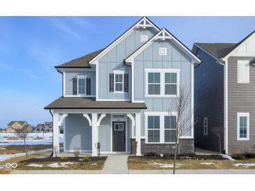Two-story house with gray siding, dark gray shutters, and a front porch at 804 James William Ln, Westfield, IN 46074
