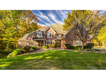 Beautiful brick two-story home with mature trees and a professionally landscaped yard at 1462 Eagle Trace Ct, Greenwood, IN 46143