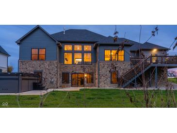 House exterior featuring a stone facade, large windows, and a deck at 1372 N Stoney Brook, Greenfield, IN 46140