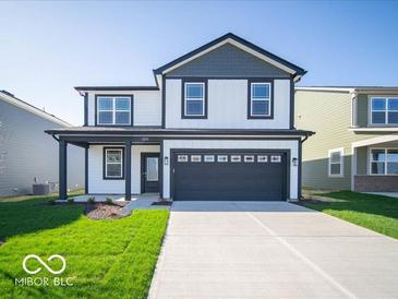 Two-story home featuring white siding, dark gray trim, a front porch, and an attached two-car garage at 1579 Hanover St, Danville, IN 46122